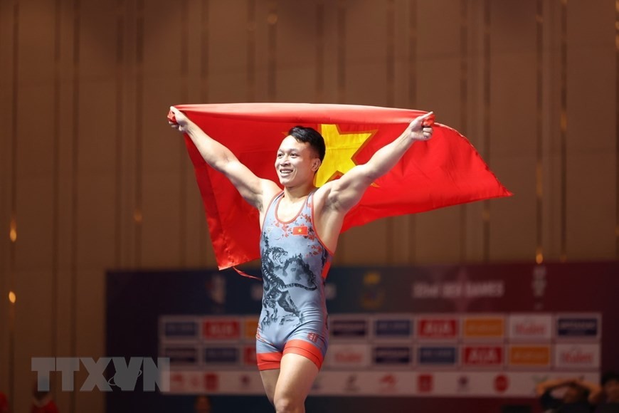 Vận động viên Nguyễn Xuân Định giành huy chương Vàng môn Vật ở hạng cân 65kg. Đây là huy chương Vàng thứ 133 của đoàn thể thao Việt Nam. (Ảnh: Minh Quyết/TTXVN)
