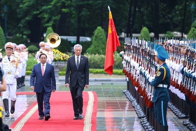 Thủ tướng Phạm Minh Chính chủ trì lễ đón Thủ tướng Singapore